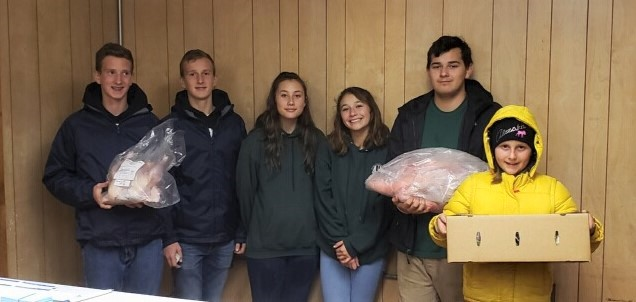 In 2019, from left, 4-H Heritage Turkey Project members Nico and Alex Bartolomei, Brylee Aubin, Yaxeli Saiz-Tapia, Uli Saiz-Tapia and Ella Bartolomei met with customers picking up the turkeys they ordered.