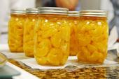 Glass jar of home-preserved tangerines