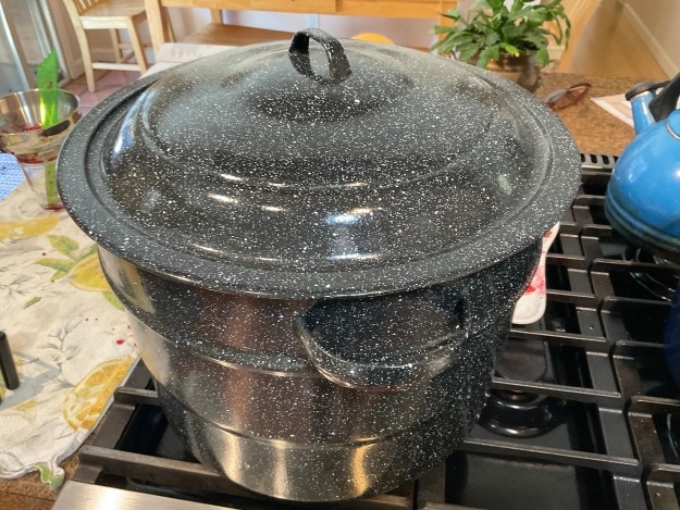 Boiling water canner on stove.