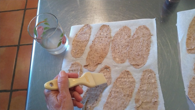 Brushing cracker dough with water(1)
