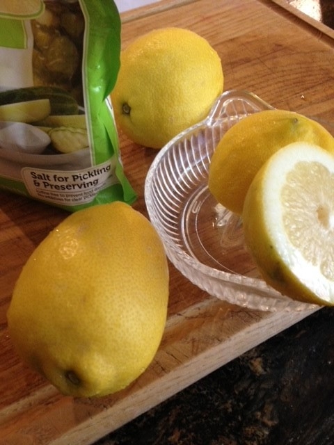 Squeezing lemon halves for juice.