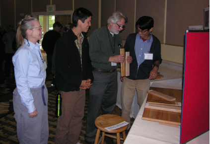 Conference participants examining tanoak samples