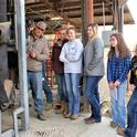 Clint Tipton shows students the hydraulic cattle chute.