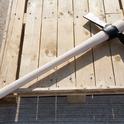 This is another heavy hitter, a mattock.  Many kinds of brush grubbing tools are available; this is just one. (bamfordtrading.com)