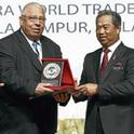 Dr. Adel Kader receiving award from Deputy Prime Minister of Malaysia, Tan Sri Muhyiddin Yassin