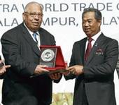 Dr. Adel Kader receiving award from Deputy Prime Minister of Malaysia, Tan Sri Muhyiddin Yassin