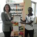 Dr. Beth Mitcham Presents a Certificate of Scholarship Award to Mekbib Hilegebrile Siefe