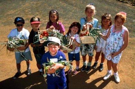 Children with garden harvest. Photo UC Regents, Deborah Giraud and Dan Desmond