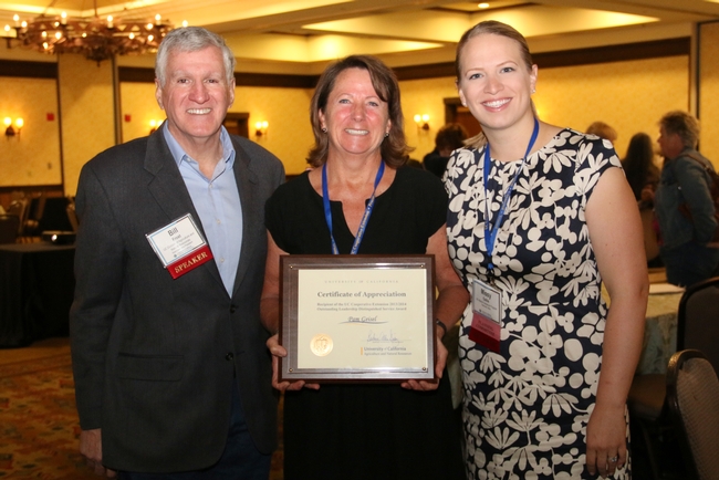 Bill Frost, associate vice president, presents Pam Geisel with the 2014 UC ANR Distinguished Service award for Outstanding Leadership. From left to right: Bill Frost, Pam Geisel and Missy Gable.