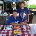 Pamela Bennetts (left) and Maria Loretta (right) UC Master Gardeners of Amador County, at an event (pre COVID-19) teaching people about how to grow food.