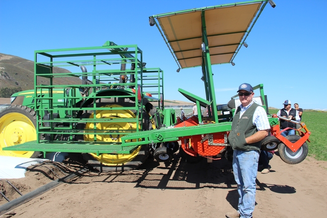 Chris Waldron with the mechanical strawberry transplanter