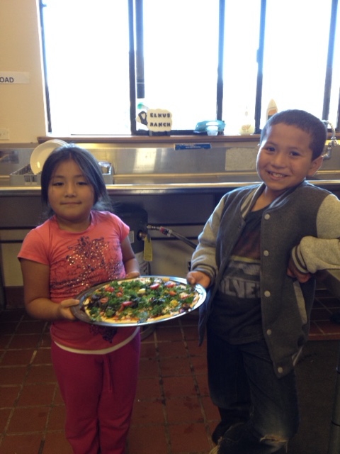 Big smiles abound as the mini-chefs display their veggie creation.