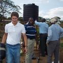 Oleg Daugovish demonstrating gravity-flow drip line irrigation system in Kenya.