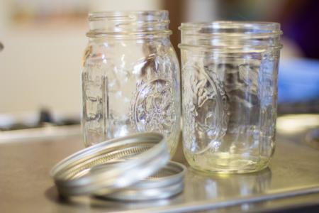 two empty glass jars and rings