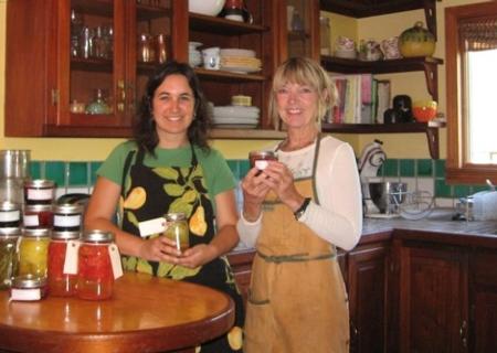 Christin Anderson & Helen Ferlino canning in her home kitchen.