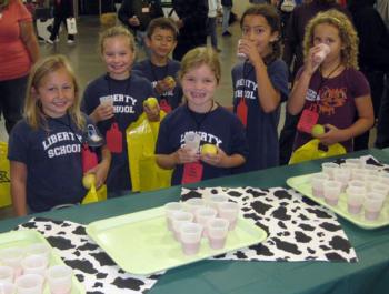 Kids enjoying milk samples at Farm Day
