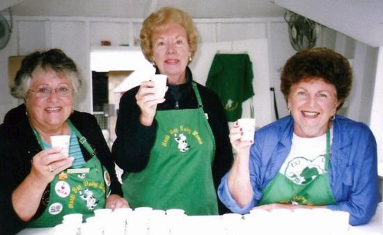 Joyce Leveroni. Arlene McClure, Audrey Muelrath hand out milk