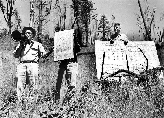 Forestry Advisor Robert Krohn with soil charts, c. 1965