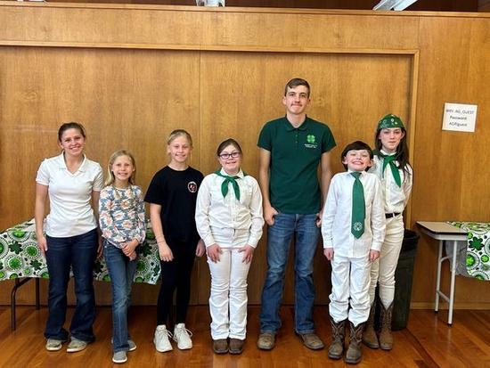 Row of 4-H youth smiling for the Presentation Day picture