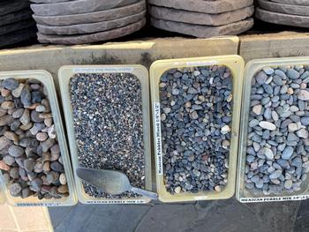 Pebbles and stones come in a variety of shapes and sizes to be used creatively throughout the garden. Photo: Jane Scurich