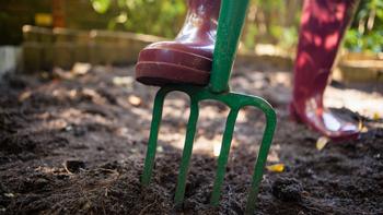 Use a spading fork to dig up moist clay soil. Photo: Envato Elements