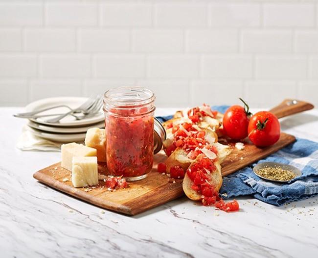 Jar of bruschetta with parmesan and crostini