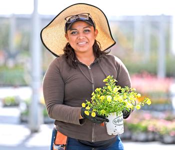nursery plant woman in hat
