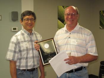 Dr. Loren Oki, UCNFA Co-Director (left) presents Jim Bethke, UCCE San Diego County (right) with the 2014 CANERS Research Award.