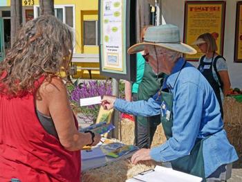 Master Gardener answering questions at the Avocado Festival.