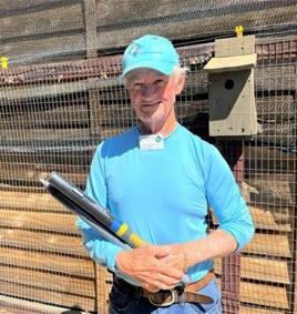 Photo by David George. UC Master Gardener Bob Archer stands ready to battle gophers.
