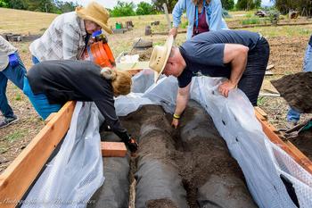 Photo by Fletcher Oakes. UC Master Gardeners build raised beds in the Water Conservation Garden in El Cerrito