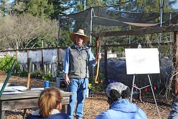 UC Master Gardener Greg Letts demonstrates various tools used to garden.