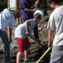 Building a raised bed with river rock & planting with native bunchgrasses.