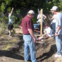 Creating a stream bed for a seasonal wetland, recirculating spring, & bog area.