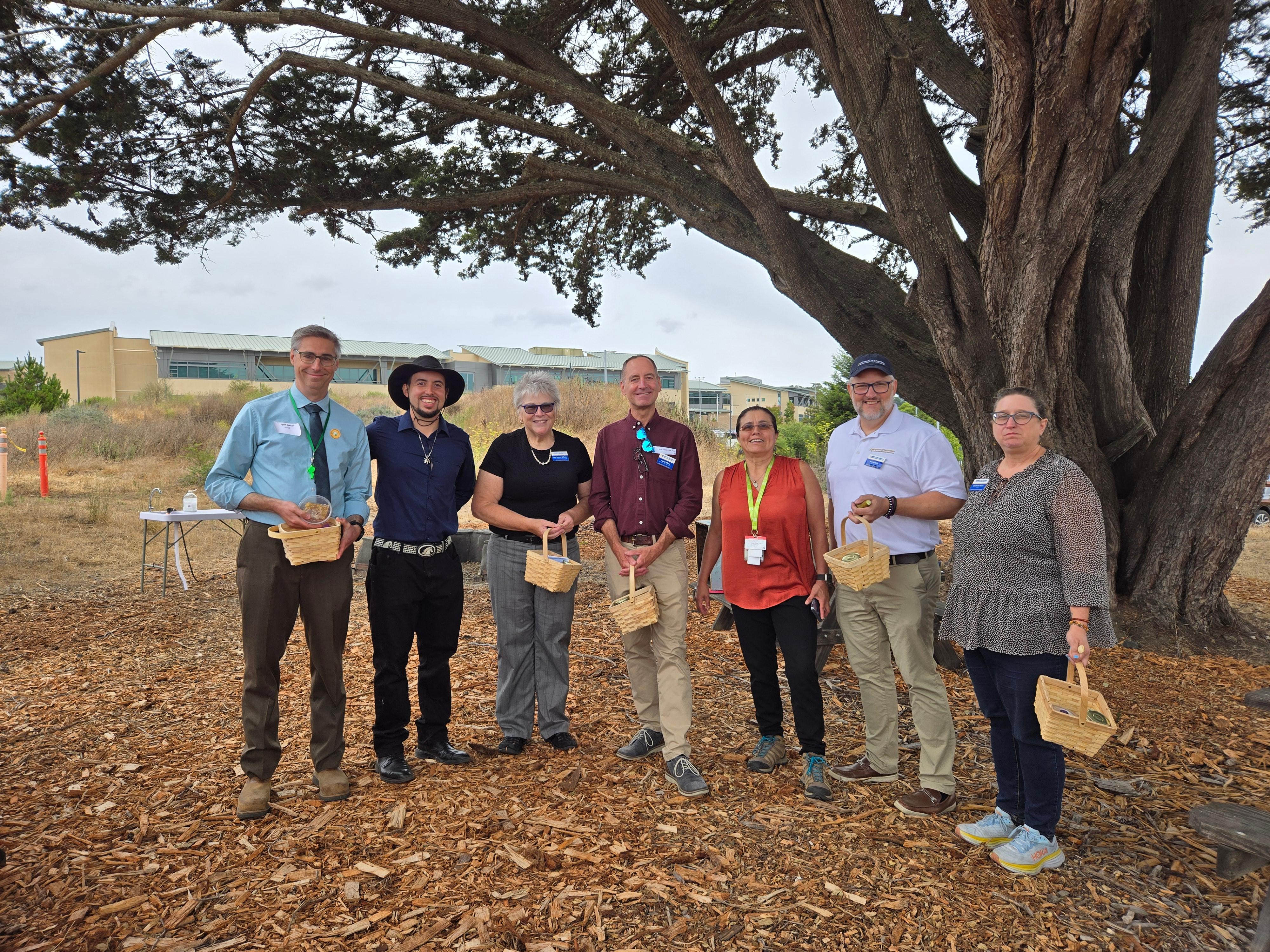 Igor, Julio (UCCE Educator), Lynn, Daniel, Regina M. (SMCo Youth Services), Brent, & Elizabeth with their honey takeaway baskets at the Phoenix Garden