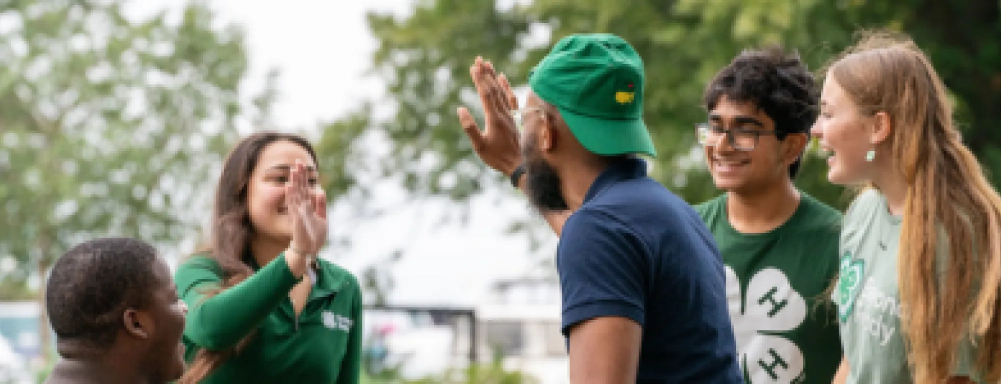 Youth giving an adult a high five