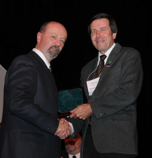 FELLOW AWARD--ESA President Michael Gray (left) presents the coveted Fellow award to UC Davis entomologist Frank Zalom. (Photo by Kathy Keatley Garvey)