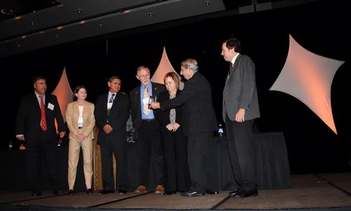 THE PRESENTATION--On stage for the ESA IPM Team Award are (from left) team member Dr. Barat Bisabri of Dow AgroSciences; Melissa Siebert, Dow AgroSciences, representing the sponsor of the award; team member Mario Viveros, UC Farm Advisor emeritus, Kern County; team member Walt Bentley, UC IPM advisor, UC Kearney Ag Center; team member Carolyn Pickel, UC IPM advisor, Sutter/Yuba counties; Dr. Bradley Vincent, presenting the award on behalf of the Entomological Foundation, and team member Dr. Frank Zalom, pro
