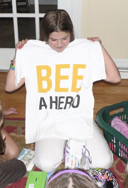 BEE CRUSADER--Hannah Fisher Gray, 11, of Wilmington, Del., asked her birthday guests to donate to the honey bee research fund instead of giving presents to her. She collected $110, and then matched the funds so she could give $110 to UC Davis and $110 to Pennyslvania State. One of her friends gave her this t-shirt.