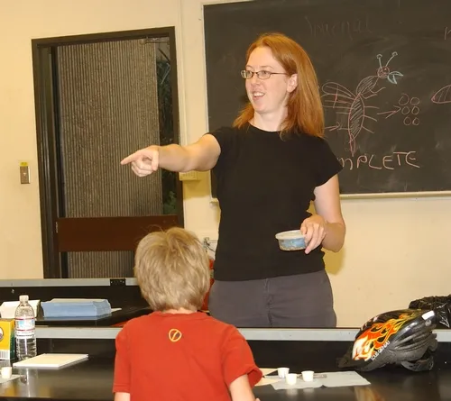 COMBINING ART AND SCIENCE--Rebecca O'Flaherty, who coined and trademarked "Maggot Art," an educational curriculum combining art and science, teaches a group of youths at a summer session at UC Davis. (Photo by Kathy Keatley Garvey)