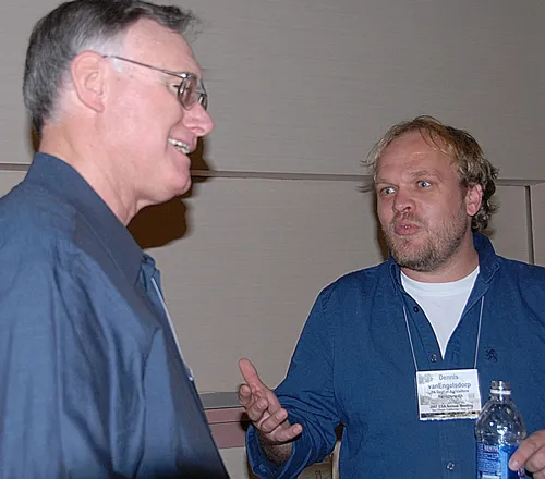 EXTENSION APICULTURIST Eric Mussen (left) of the UC Davis Department of Entomology faculty shares information with Pennsylvania State Uniersity entomologist Dennis van Engelsdorp at the 2007 meeting of the Entomological Society of America. UC Davis and Penn State receive research funds in a project launched by Haagen-Dazs. (Photo by Kathy Keatley Garvey)