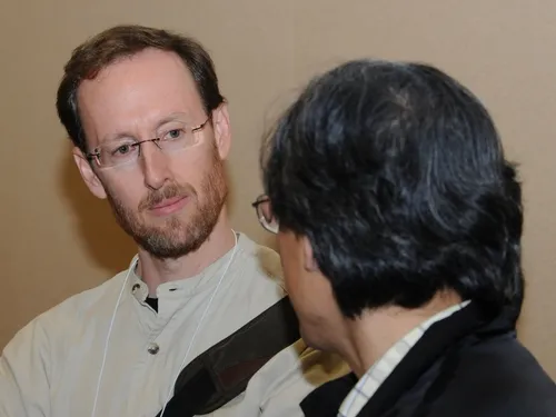 JAY ROSENHEIM, shown here talking to a colleague at a meeting of the Entomological Society of America, is a newly elected Fellow of the American Association for the Advancement of Science. He joined the UC Davis Department of Entomology faculty in 1990. (Photo by Kathy Keatley Garvey)