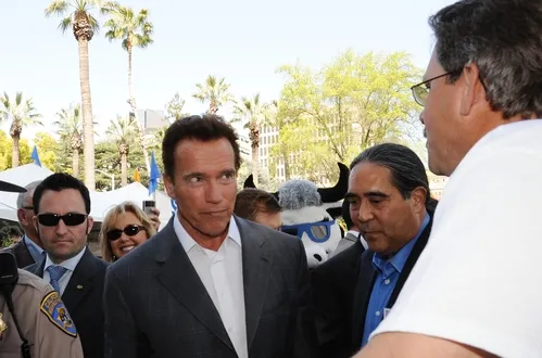 CALIFORNIA Gov. Arnold Schwarzenegger (center) and California Secretary of Agriculture A. G. Kawamura (right) listen to beekeeper Brian Fishback talk about the declining bee population. (Photo by Kathy Keatley Garvey)