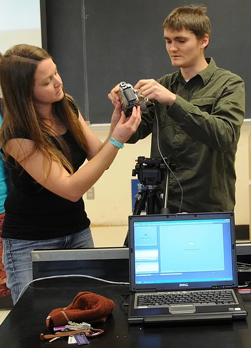 ENTOMOLOGY GRADUATE STUDENTS Amy Morice and James Harwood check out a camera. They were among the students in James R. Carey's class on "How to Make an Insect Collection." The video clips are now posted on the UC Davis Department of Entomology website. (Photo by Kathy Keatley Garvey)
