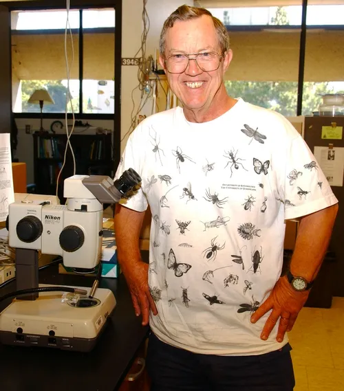 EMERITUS PROFESSOR Hugh Dingle, shown here wearing one of his favorite "bug" shirts, will discuss the rapidly evolving soapberry bug at a noon seminar on Wednesday, Nov. 10 in 122 Briggs Hall, UC Davis. (Photo by Kathy Keatley Garvey)