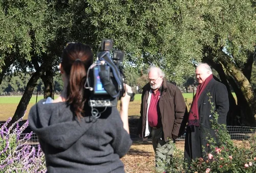 BUMBLE BEE EXPERT Robbin Thorp (center) discusses the declining bumble bee population with KTVU health and science editor John Fowler. Operating the camera is Erica Hintergardt. (Photo by Kathy Keatley Garvey)