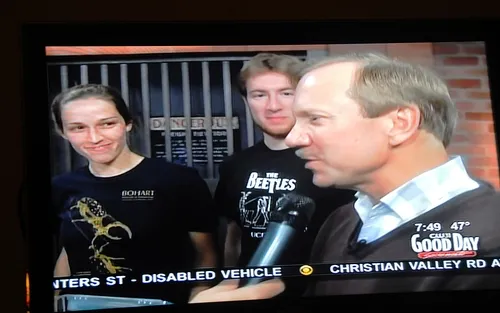 UC DAVIS Department of Entomology faculty member Larry Godfrey (right) answers questions about bugs. Behind him are Meredith Cenzer and Matan Shelomi. (Photo of Good Day Sacramento TV screen by Kathy Keatley Garvey)