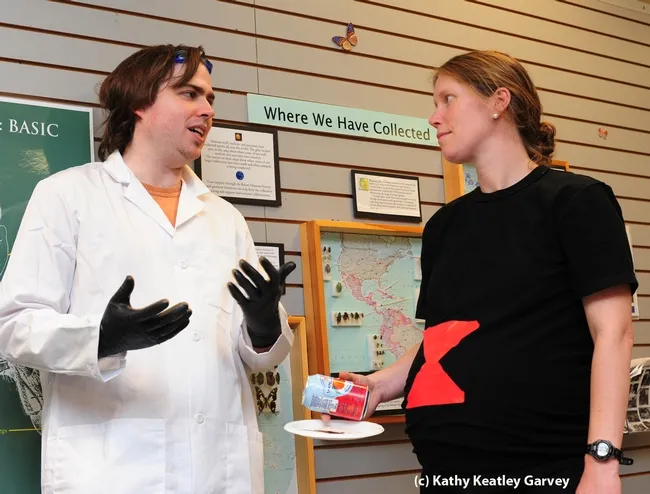 Entomologist Nick Herold chats with "black widow spider" Tabatha Yang. (Photo by Kathy Keatley Garvey)