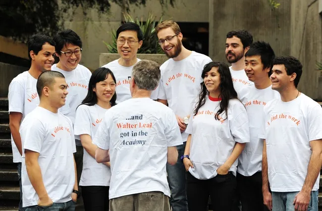 Walter Leal (back to camera) talking to his lab members. (Photo by Kathy Keatley Garvey)