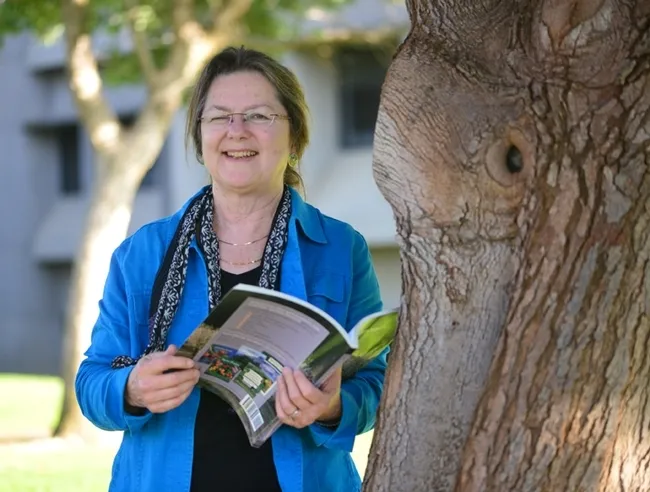 Mary Lou Flint outside her new office at Briggs Hall. (Photo by Kathy Keatley Garvey)